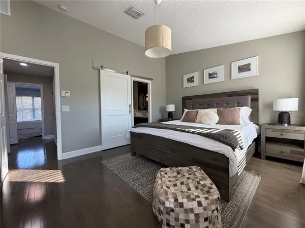 a bathroom with a double vanity sink mirror bathtub and shower