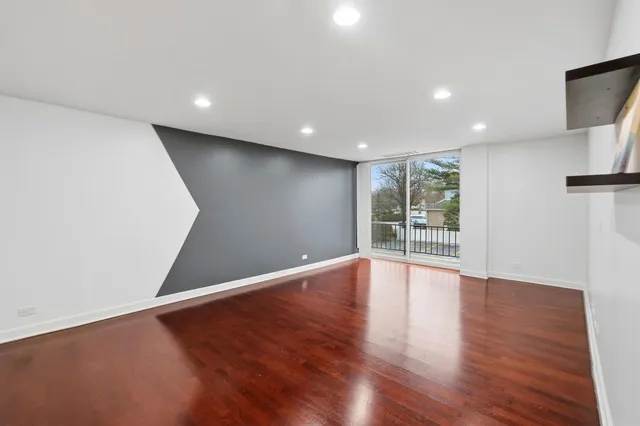 a view of kitchen with wooden floor and electronic appliances