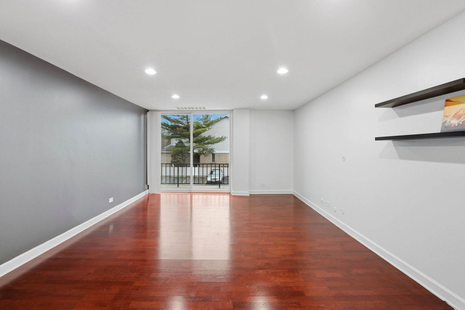 190 South Wood Dale Road, Unit 200 Wood Dale, IL 60191 - Photo 17 of 34 a view of an empty room with wooden floor and a window
