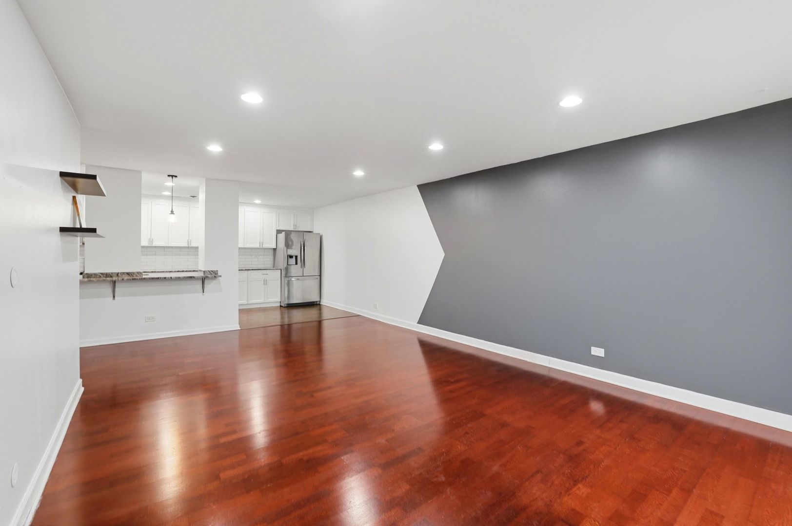 190 South Wood Dale Road, Unit 200 Wood Dale, IL 60191 - Photo 18 of 34 a view of kitchen with refrigerator and wooden floor