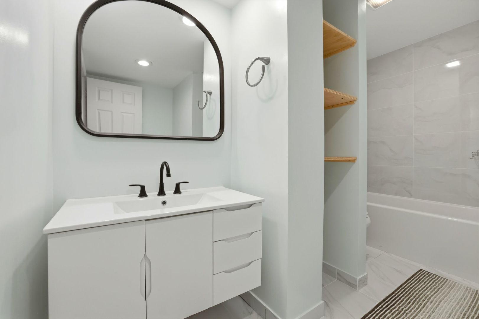190 South Wood Dale Road, Unit 200 Wood Dale, IL 60191 - Photo 22 of 34 a bathroom with a sink and a mirror