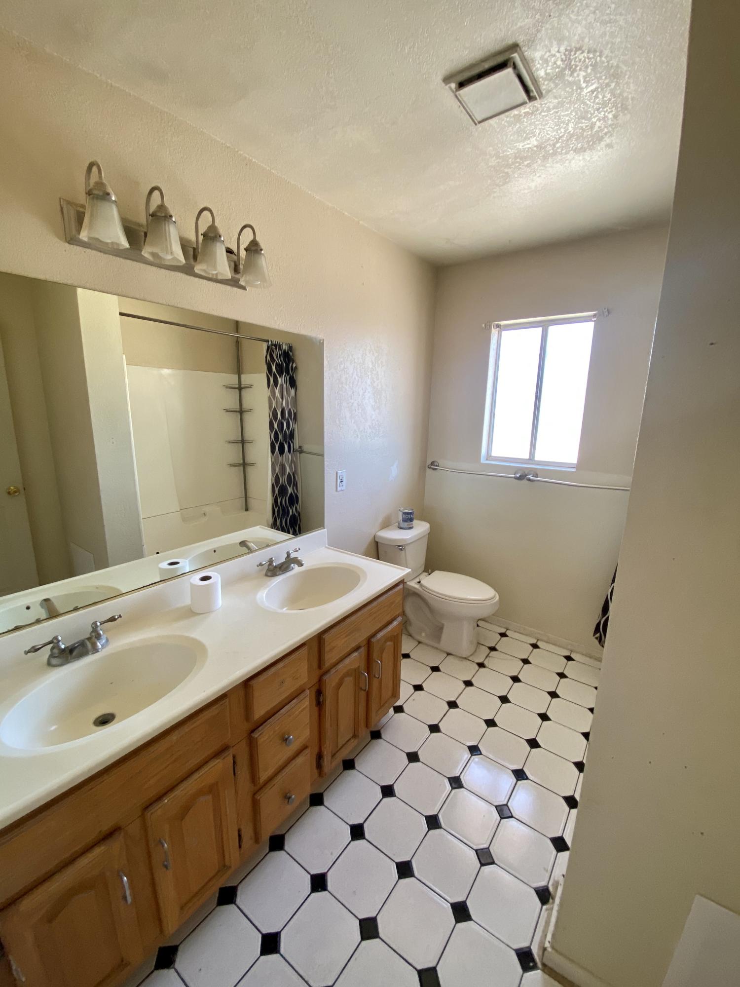 660 North 6th Street Blythe, CA 92225 - Photo 7 of 13 a bathroom with a sink mirror and vanity