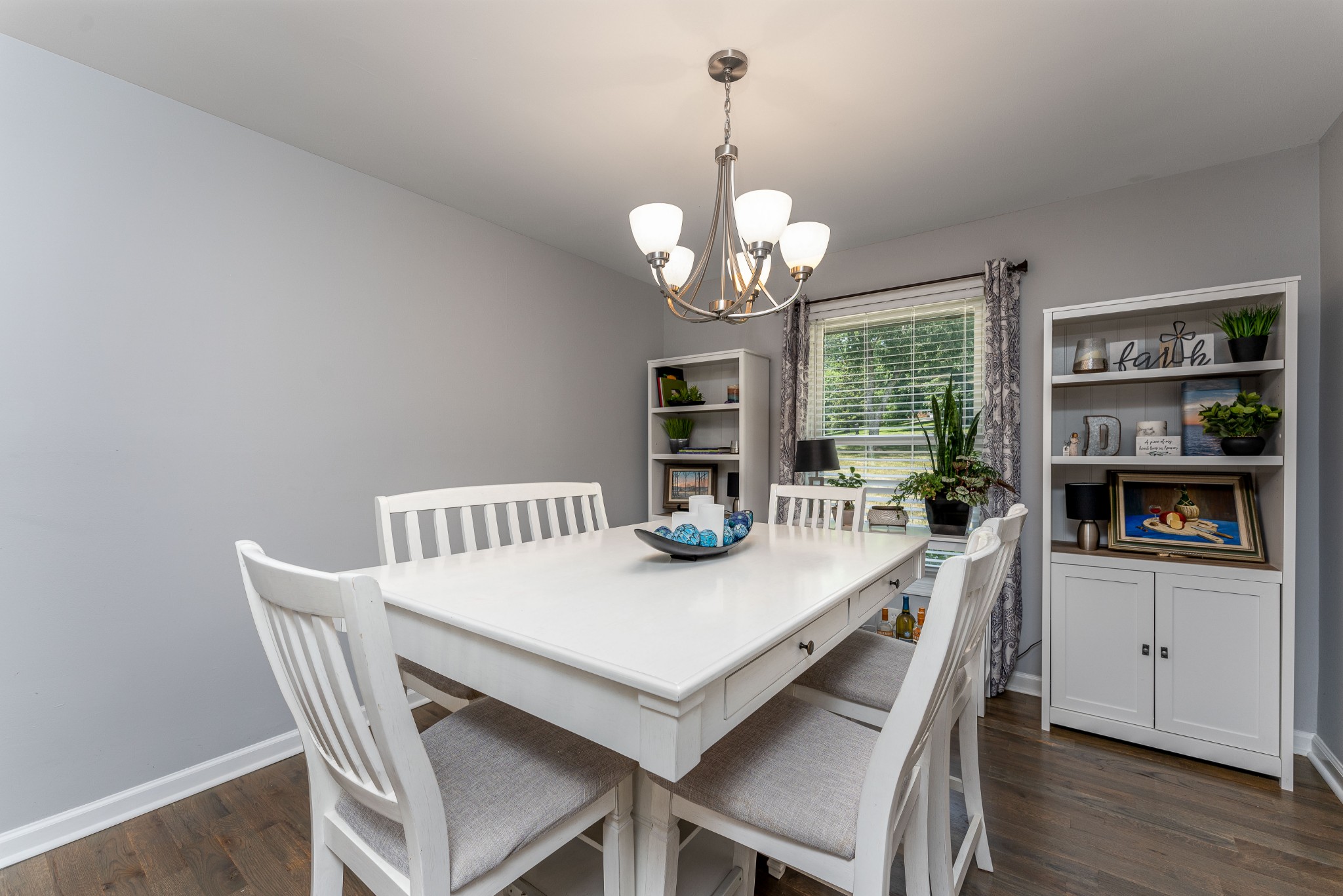 710 High Point Ridge Road Franklin, TN 37069 - Photo 20 of 32 a view of a dining room with furniture a chandelier and wooden floor