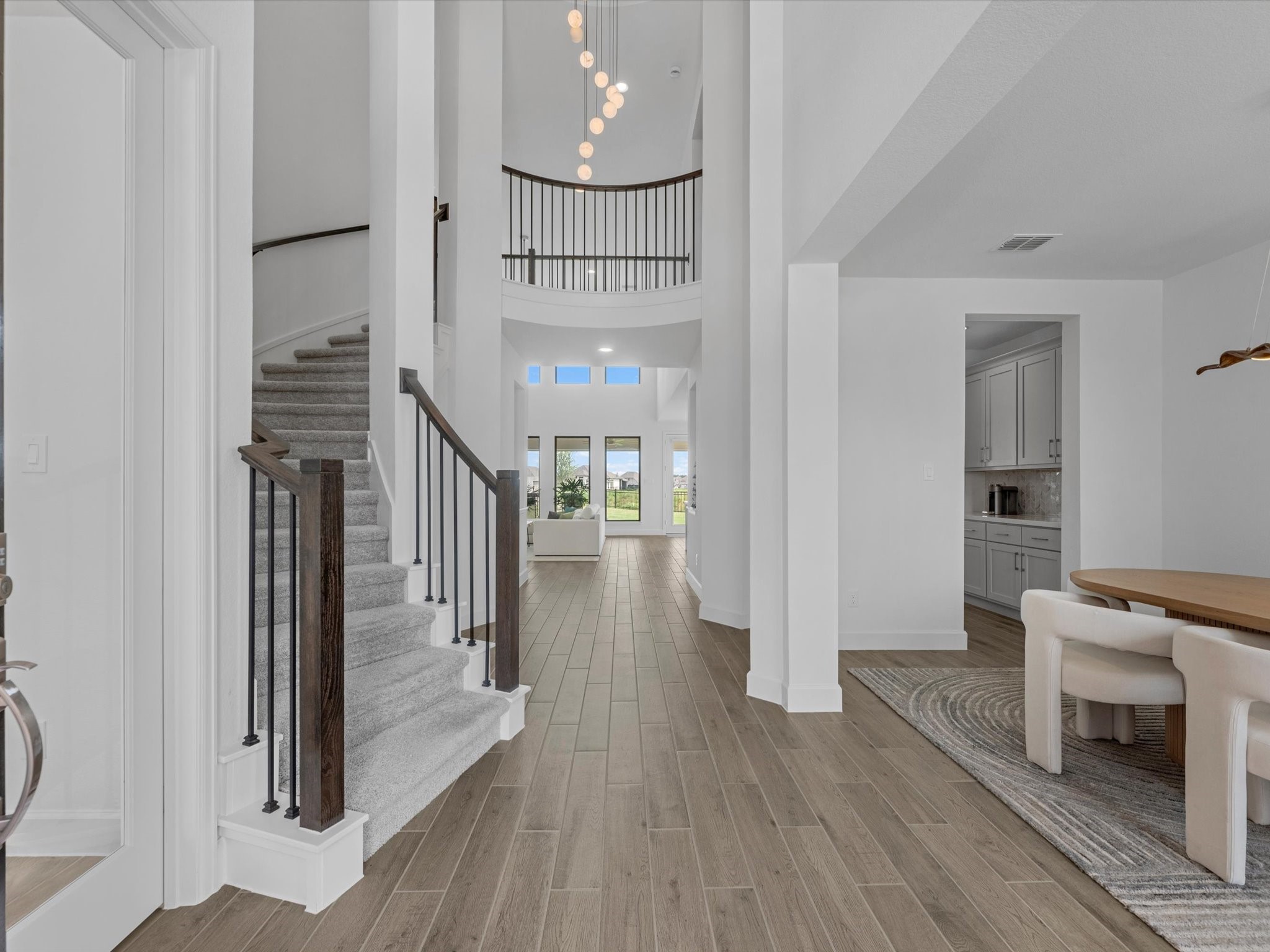 18714 Pistachio Way Manvel, TX 77578 - Photo 5 of 48 An impressive first impression featuring a sweeping spiral staircase, private home office, formal dining room, butler's pantry, and views into the heart of the home.