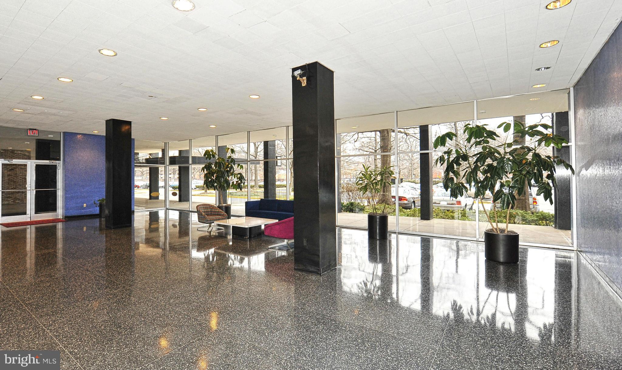 1301 Delaware Avenue Southwest, Unit N504 Washington, DC 20024 - Photo 14 of 29 a lobby with furniture and floor to ceiling window