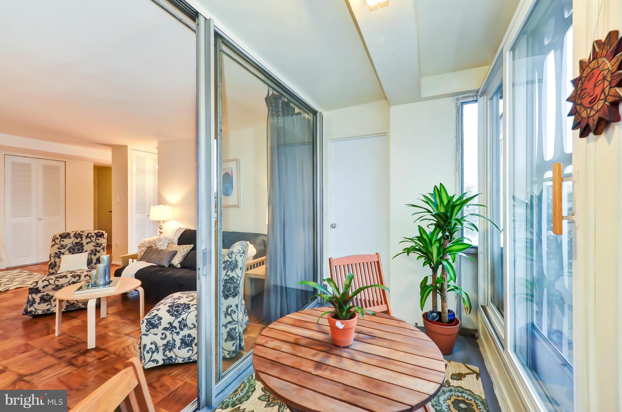 1301 Delaware Avenue Southwest, Unit N504 Washington, DC 20024 - Photo 3 of 29 a outdoor living space with furniture and a potted plant