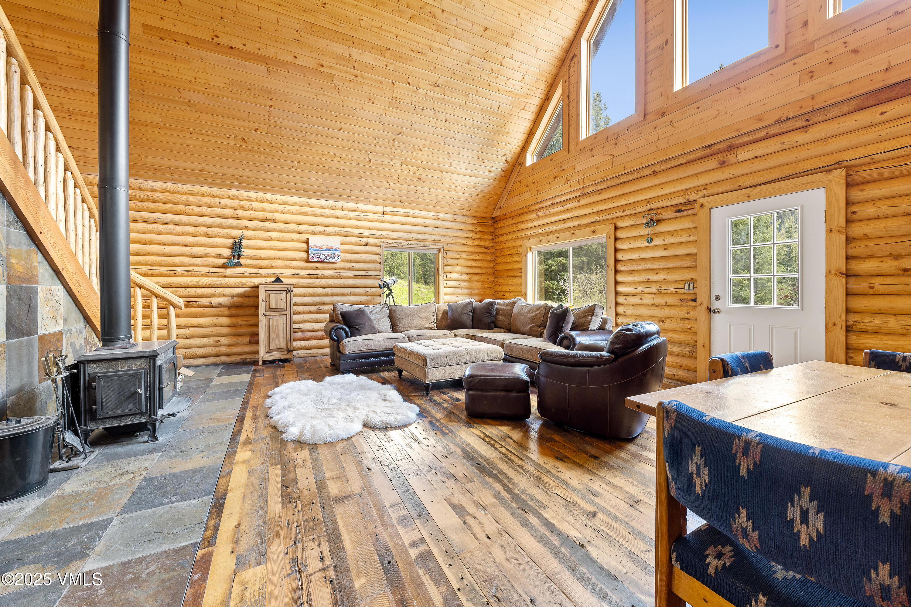 320 Mill Eagle Co 81631 Eagle, CO 81631 - Photo 14 of 33 a view of a patio with dining table and chairs with wooden floor