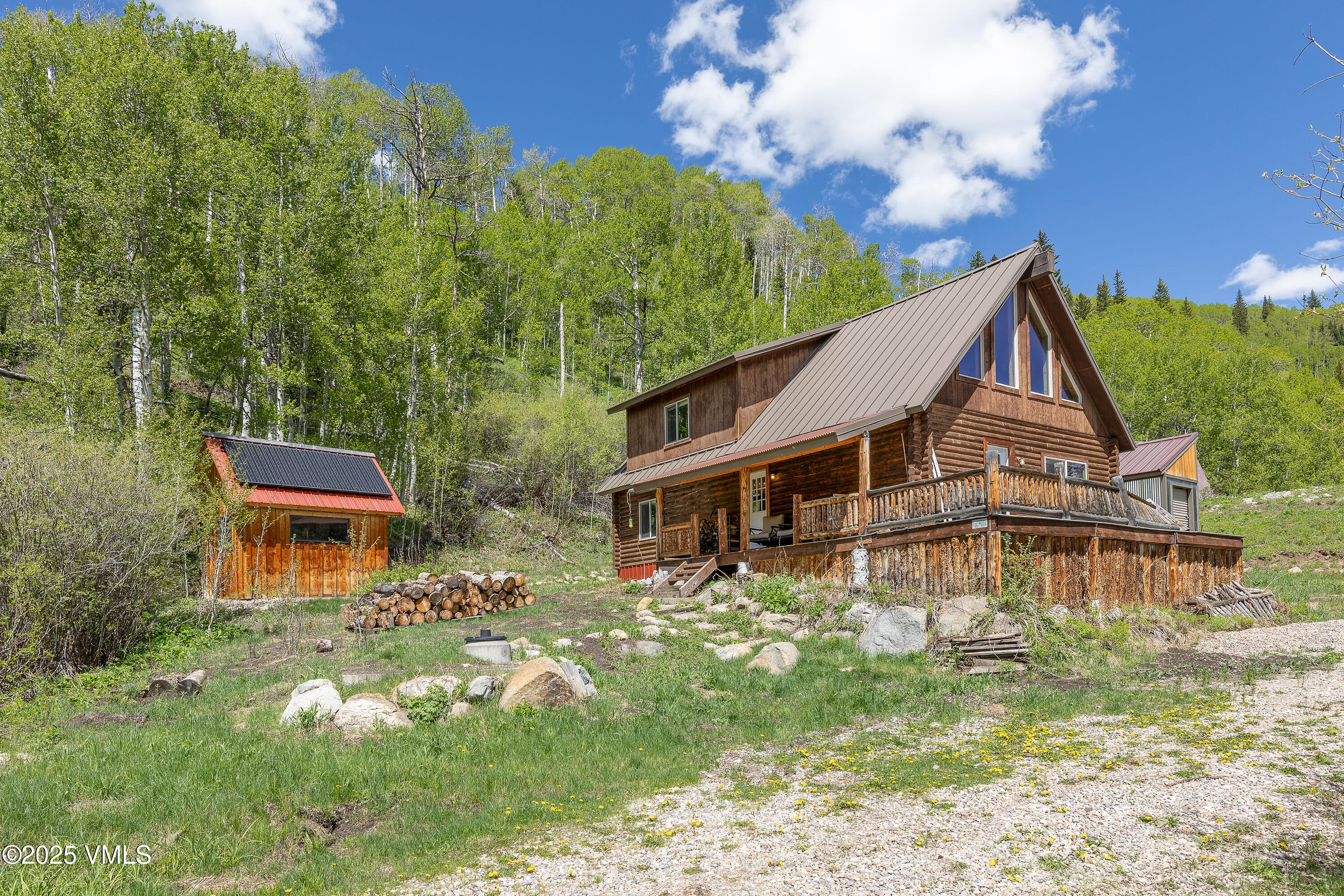 320 Mill Eagle Co 81631 Eagle, CO 81631 - Photo 2 of 33 a aerial view of a house with swimming pool next to a yard