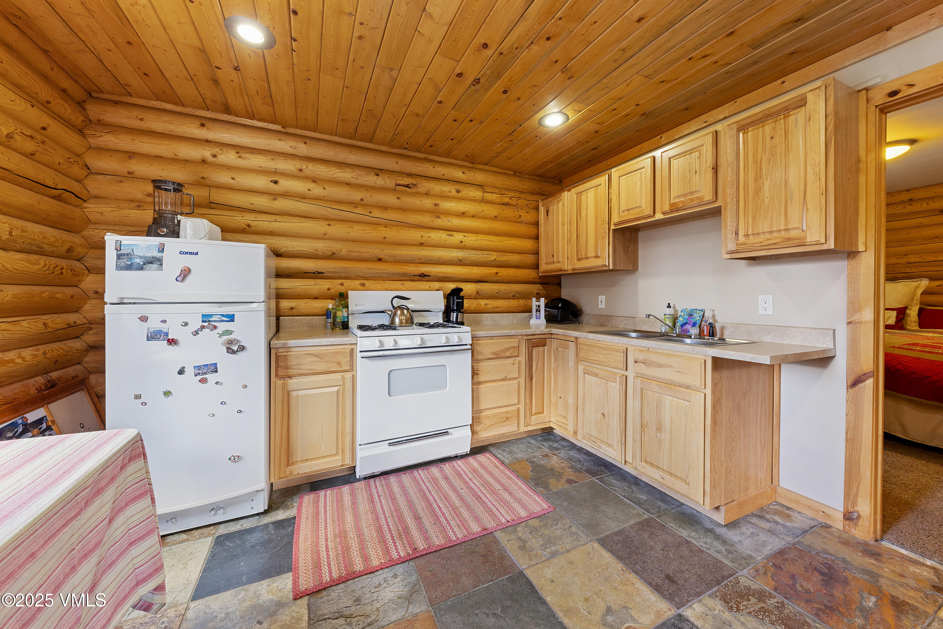 320 Mill Eagle Co 81631 Eagle, CO 81631 - Photo 22 of 33 a kitchen with cabinets appliances and a window