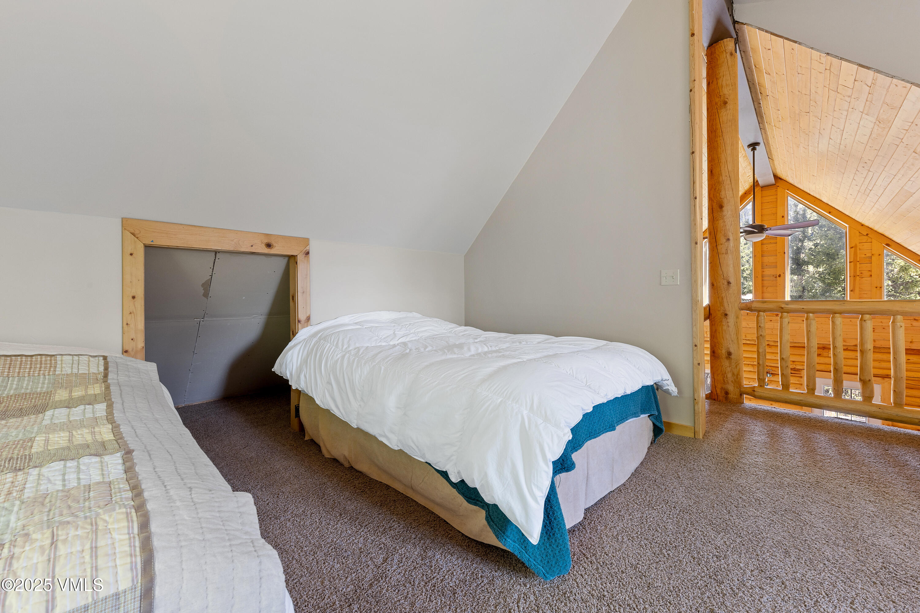 320 Mill Eagle Co 81631 Eagle, CO 81631 - Photo 29 of 33 a spacious bedroom with a bed and a window