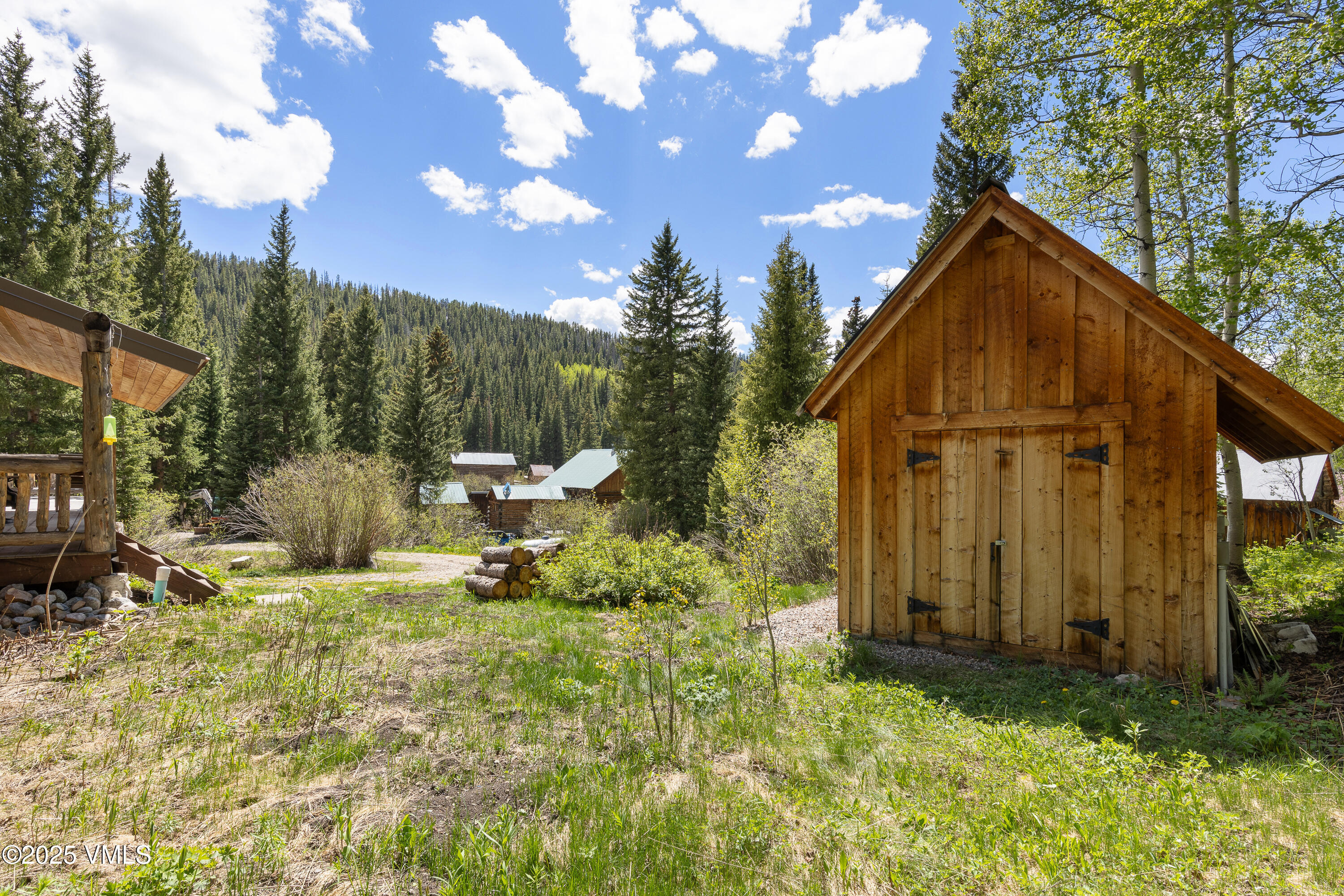 320 Mill Eagle Co 81631 Eagle, CO 81631 - Photo 5 of 33 a backyard of a house with table and chairs