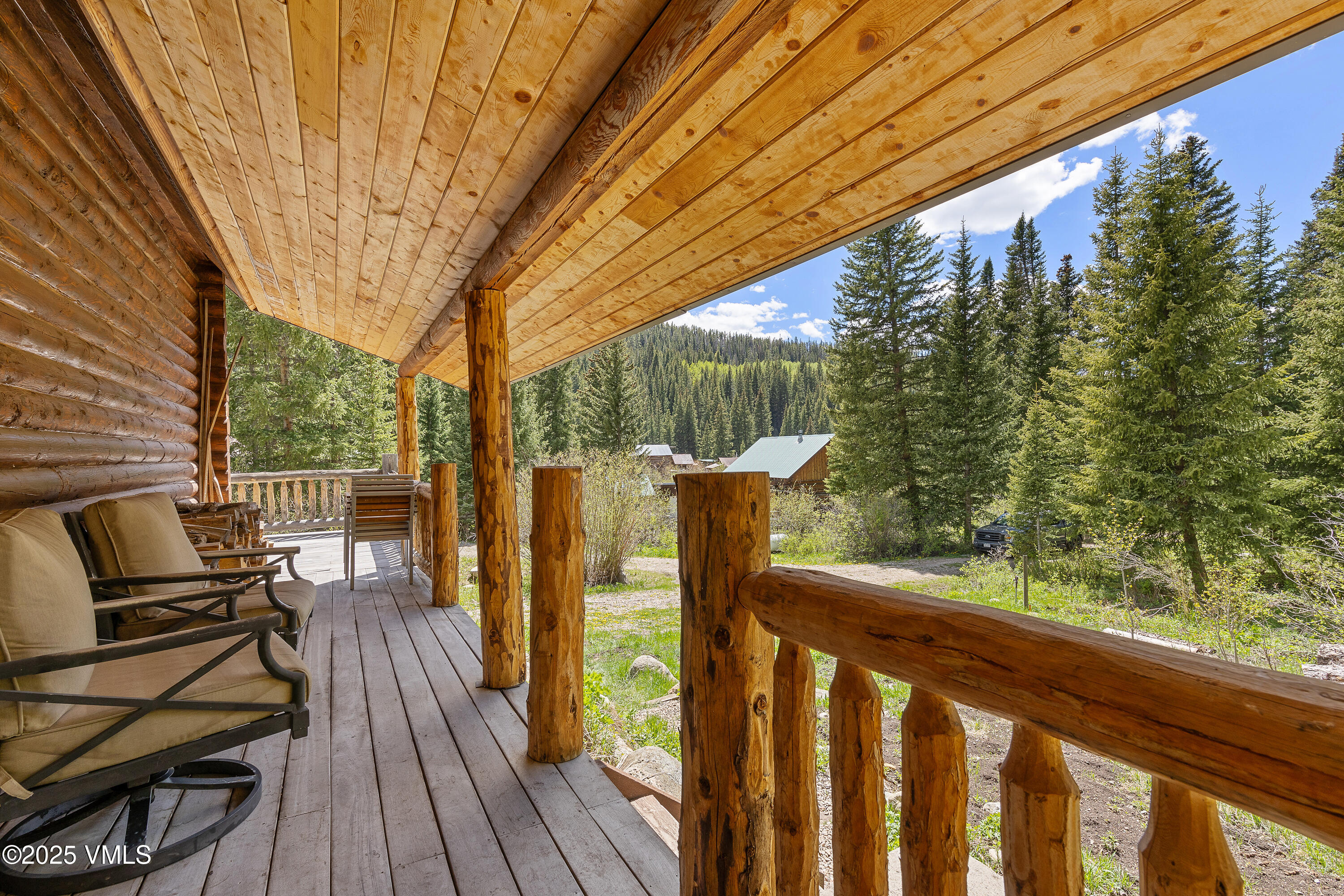 320 Mill Eagle Co 81631 Eagle, CO 81631 - Photo 9 of 33 a view of a balcony with chairs and wooden floor