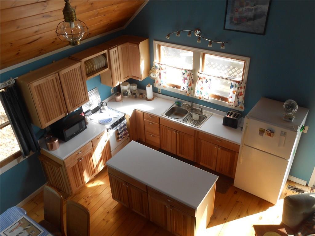 15 Pine Point Road Harrison, ME 04040 - Photo 13 of 33 Lots of light floods the kitchen area.