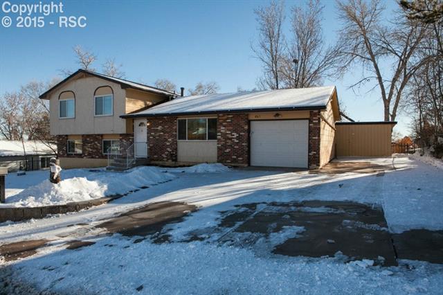 6965 Chippewa Road Colorado Springs, CO 80915 - Photo 31 of 31 Snowy day, but I wanted you to see the large RV parking area and huge driveway. Bring all your toys! You can easily park 6 medium sized vehicles on this driveway. How about a boat, RV, and trailer?