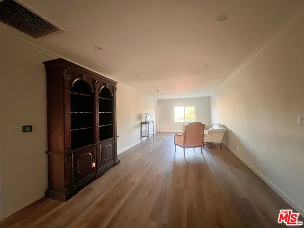 a view of a livingroom with furniture and wooden floor