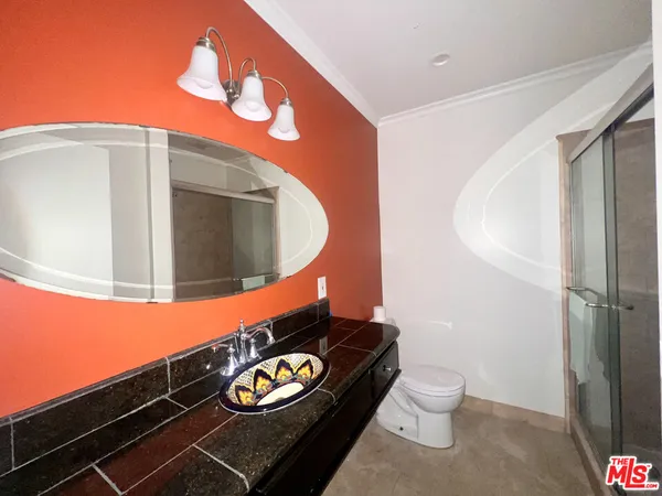 a bathroom with a toilet and a sink