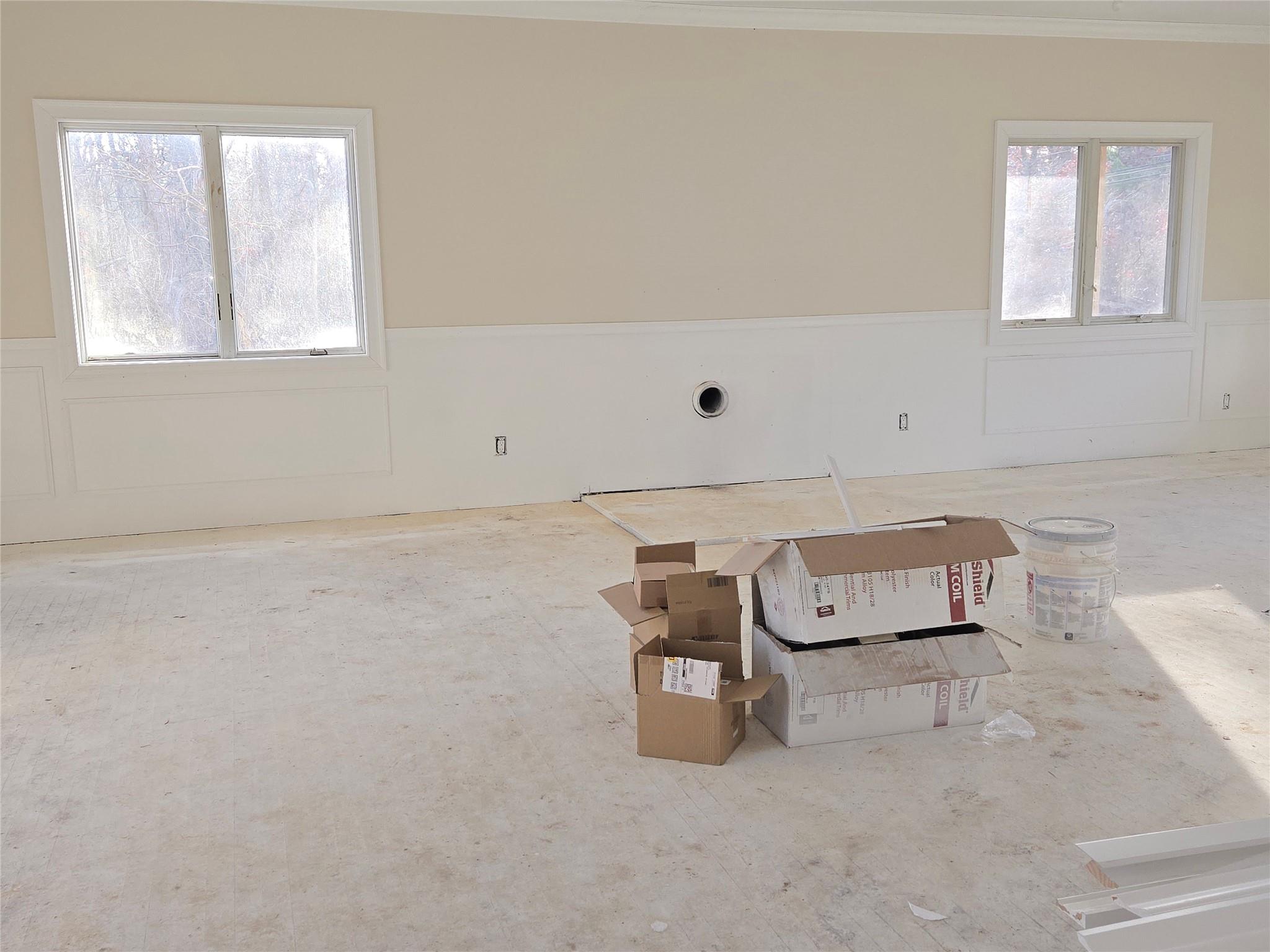 85 Smith Road Ridge, NY 11961 - Photo 13 of 26 Unfurnished room with a wainscoted wall, a decorative wall, and crown molding