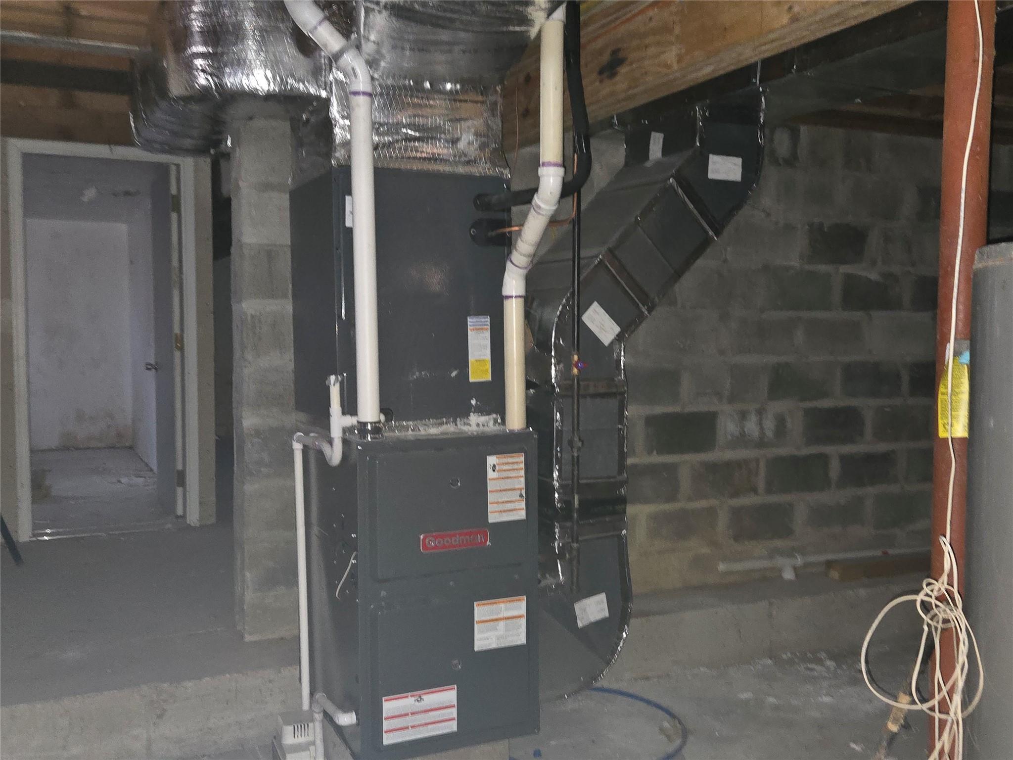 85 Smith Road Ridge, NY 11961 - Photo 25 of 26 Utility room featuring gas water heater