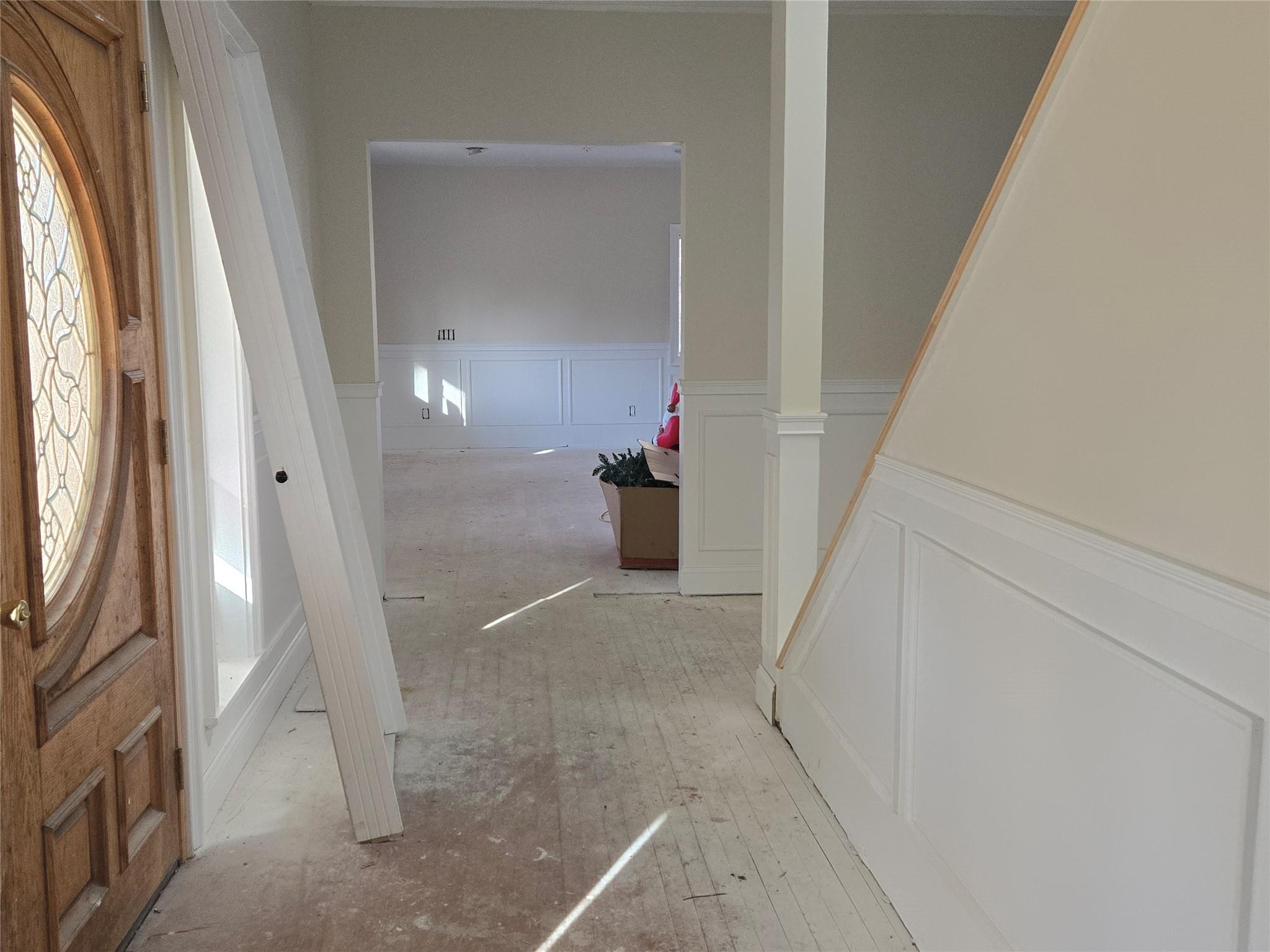 85 Smith Road Ridge, NY 11961 - Photo 4 of 26 Foyer featuring a decorative wall and a wainscoted wall
