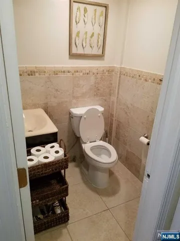 a bathroom with a toilet a sink and bathtub