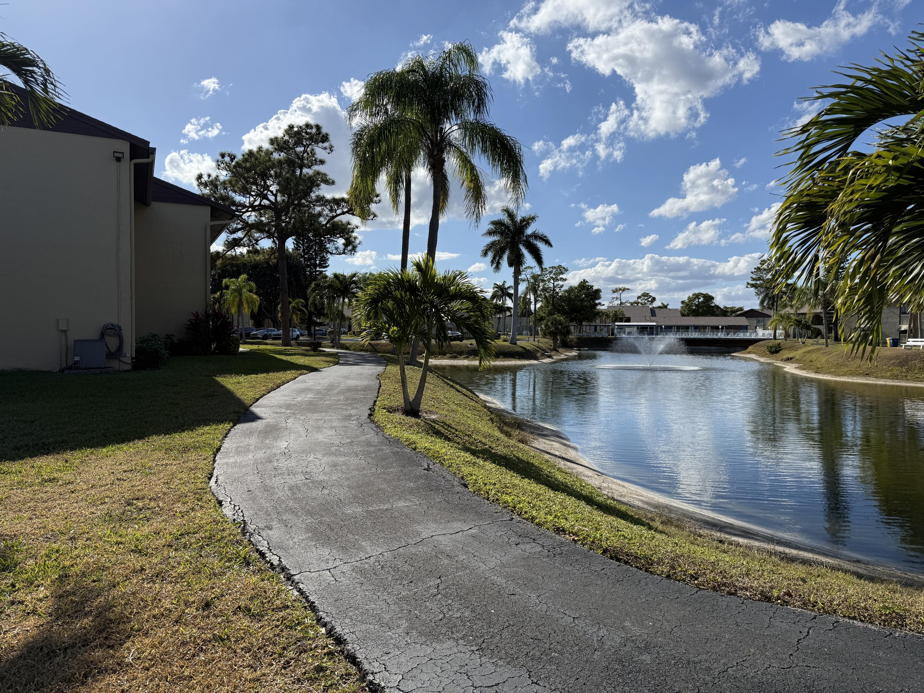 338 Pine Ridge Circle, Unit B2 Greenacres, FL 33463 - Photo 3 of 55 Front Walk East