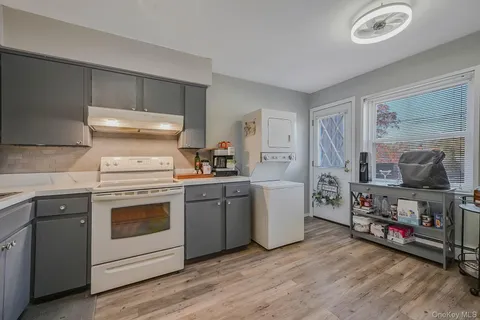 a kitchen with a stove and a refrigerator