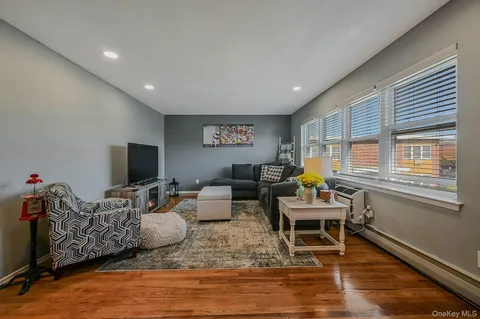 a living room with furniture or couch and a flat screen tv