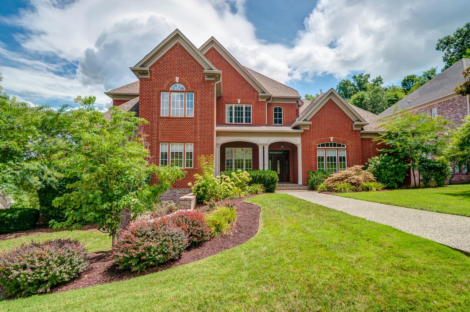 476 Sandcastle Road Franklin, TN 37069 - Photo 2 of 23 a front view of a house with garden