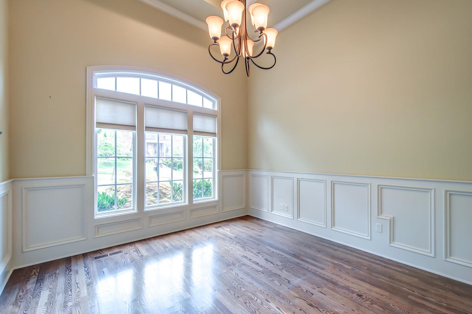 476 Sandcastle Road Franklin, TN 37069 - Photo 11 of 23 a view of an empty room with wooden floor and fan