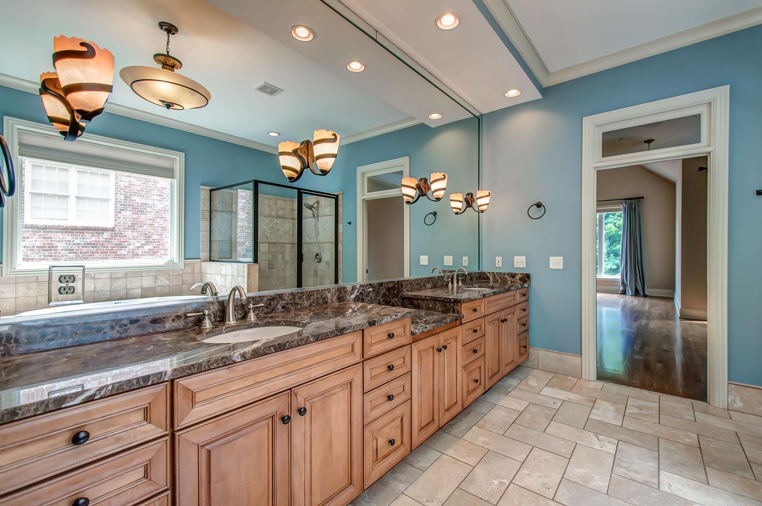 476 Sandcastle Road Franklin, TN 37069 - Photo 13 of 23 a large kitchen with granite countertop a sink and a stove