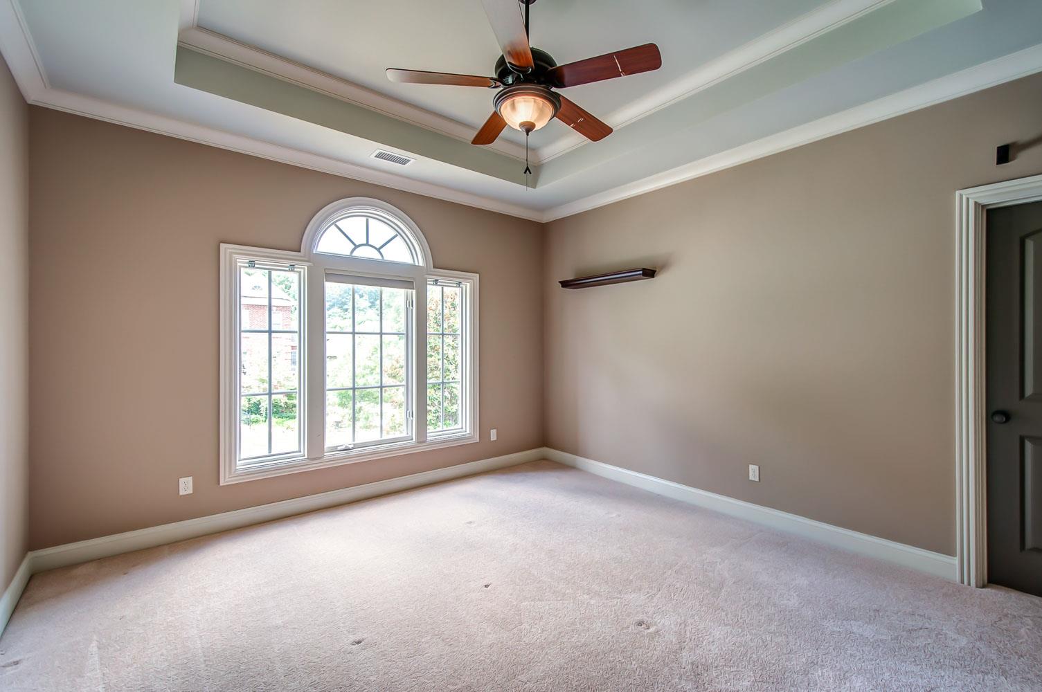 476 Sandcastle Road Franklin, TN 37069 - Photo 18 of 23 an empty room with a chandelier fan and windows