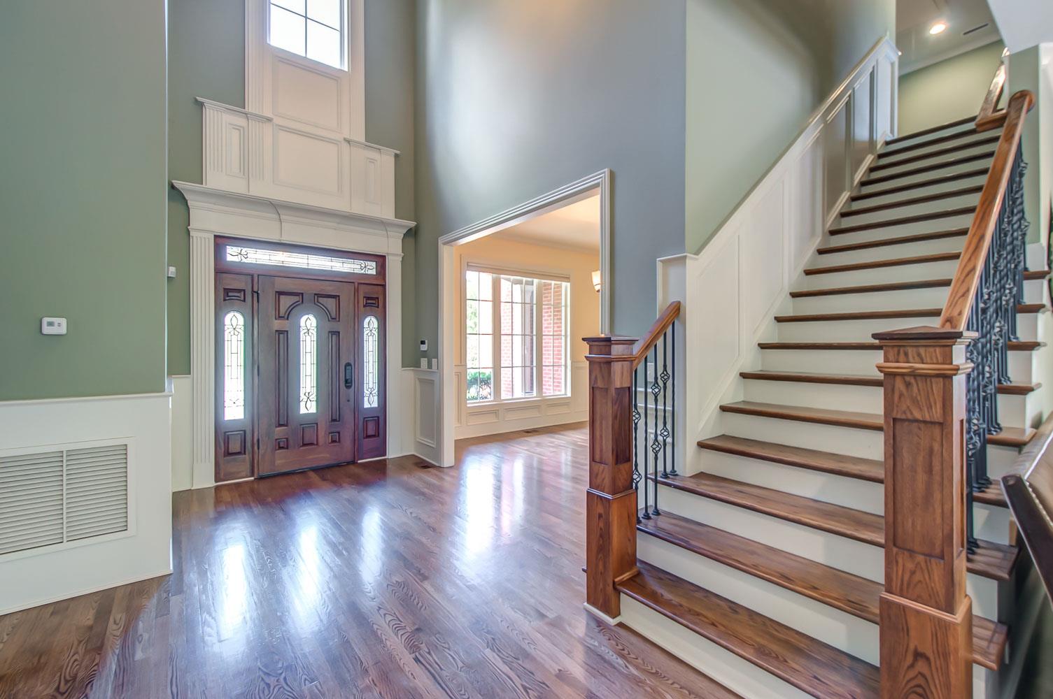 476 Sandcastle Road Franklin, TN 37069 - Photo 3 of 23 a view of a hallway with wooden floor and windows
