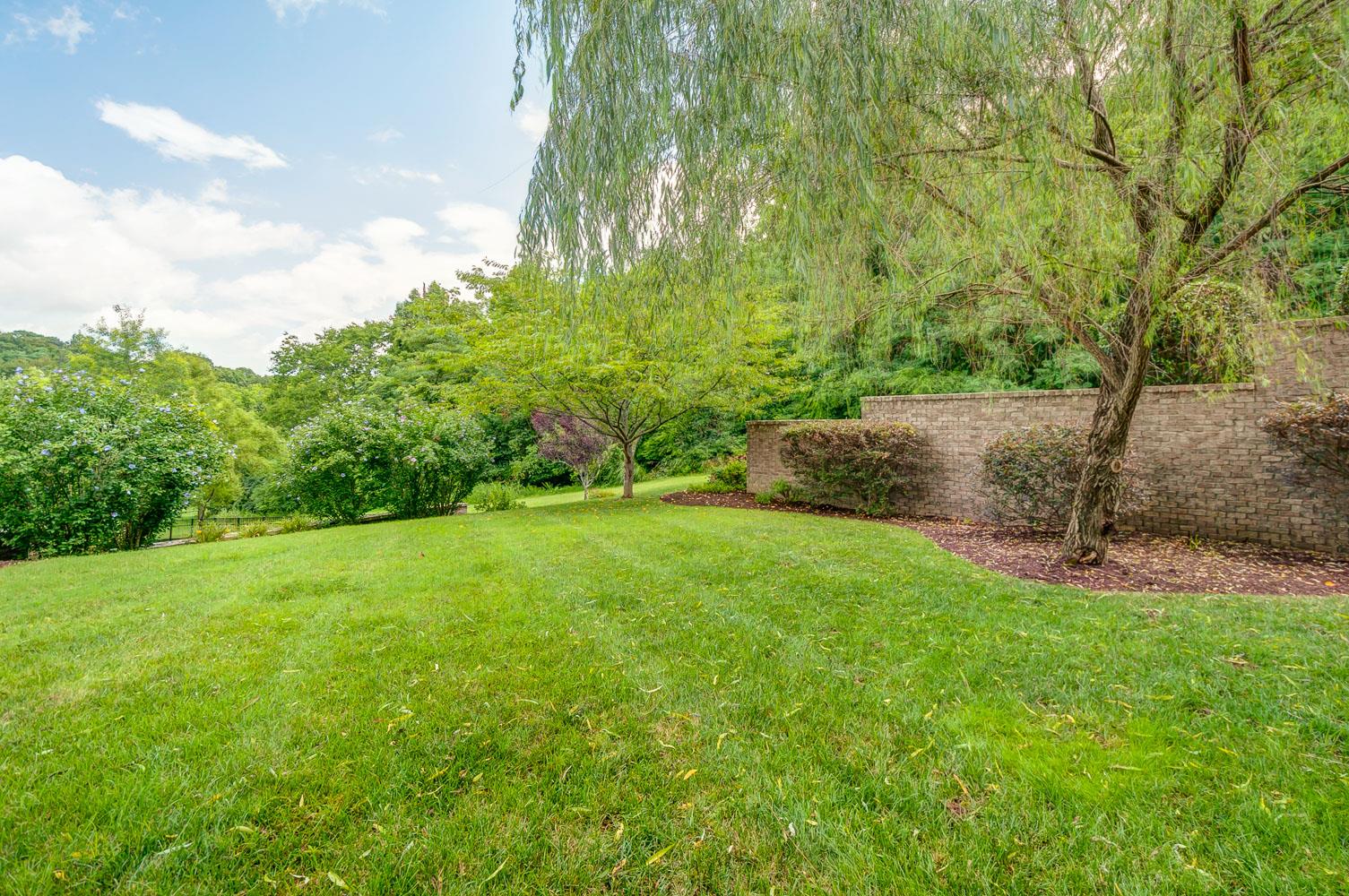 476 Sandcastle Road Franklin, TN 37069 - Photo 21 of 23 a view of a grassy field with trees