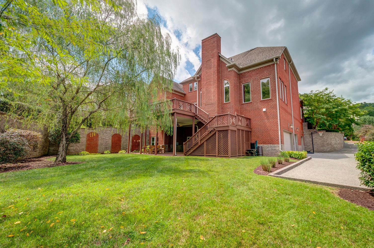476 Sandcastle Road Franklin, TN 37069 - Photo 22 of 23 a view of a house with a yard and pathway