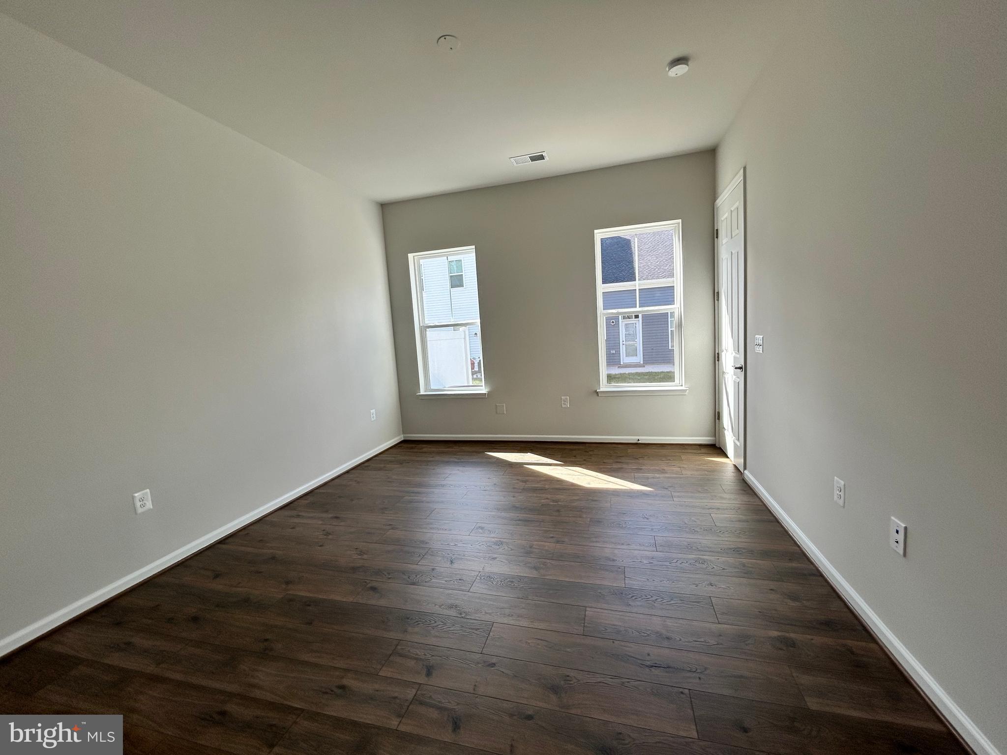 9370 Crestview Rdg Drive Bristow, VA 20136 - Photo 14 of 31 an empty room with wooden floor and windows