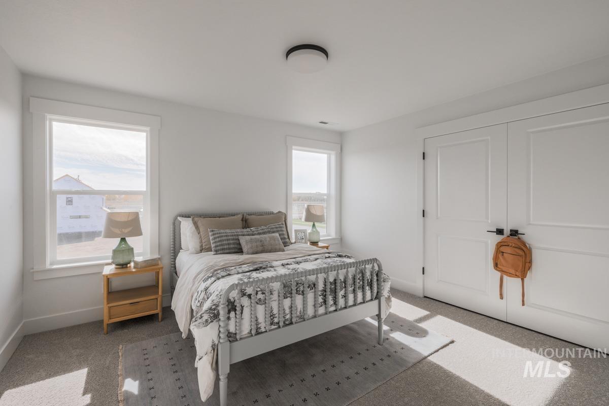 6091 South Apex Avenue Meridian, ID 83642 - Photo 36 of 40 Carpeted bedroom featuring baseboards
