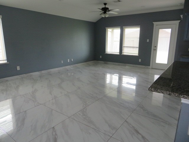 23210 Barberry Crk Trail Spring, TX 77373 - Photo 31 of 33 en empty room with windows and ceiling fan