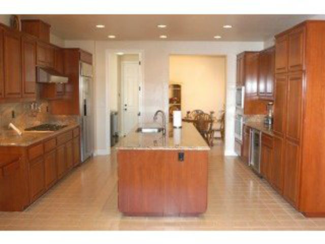 1547 Rangewood Drive San Jose, CA 95138 - Photo 2 of 9 a kitchen with stainless steel appliances granite countertop a sink and a refrigerator