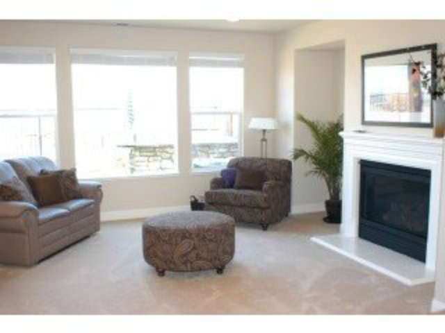 1547 Rangewood Drive San Jose, CA 95138 - Photo 3 of 9 a living room with furniture and a fireplace