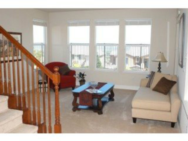 1547 Rangewood Drive San Jose, CA 95138 - Photo 5 of 9 a living room with furniture and a large window