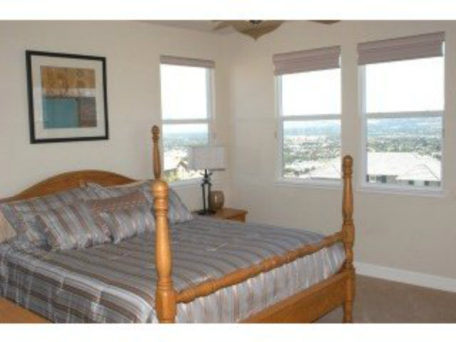 1547 Rangewood Drive San Jose, CA 95138 - Photo 6 of 9 a living room with a bed furniture and next to a window