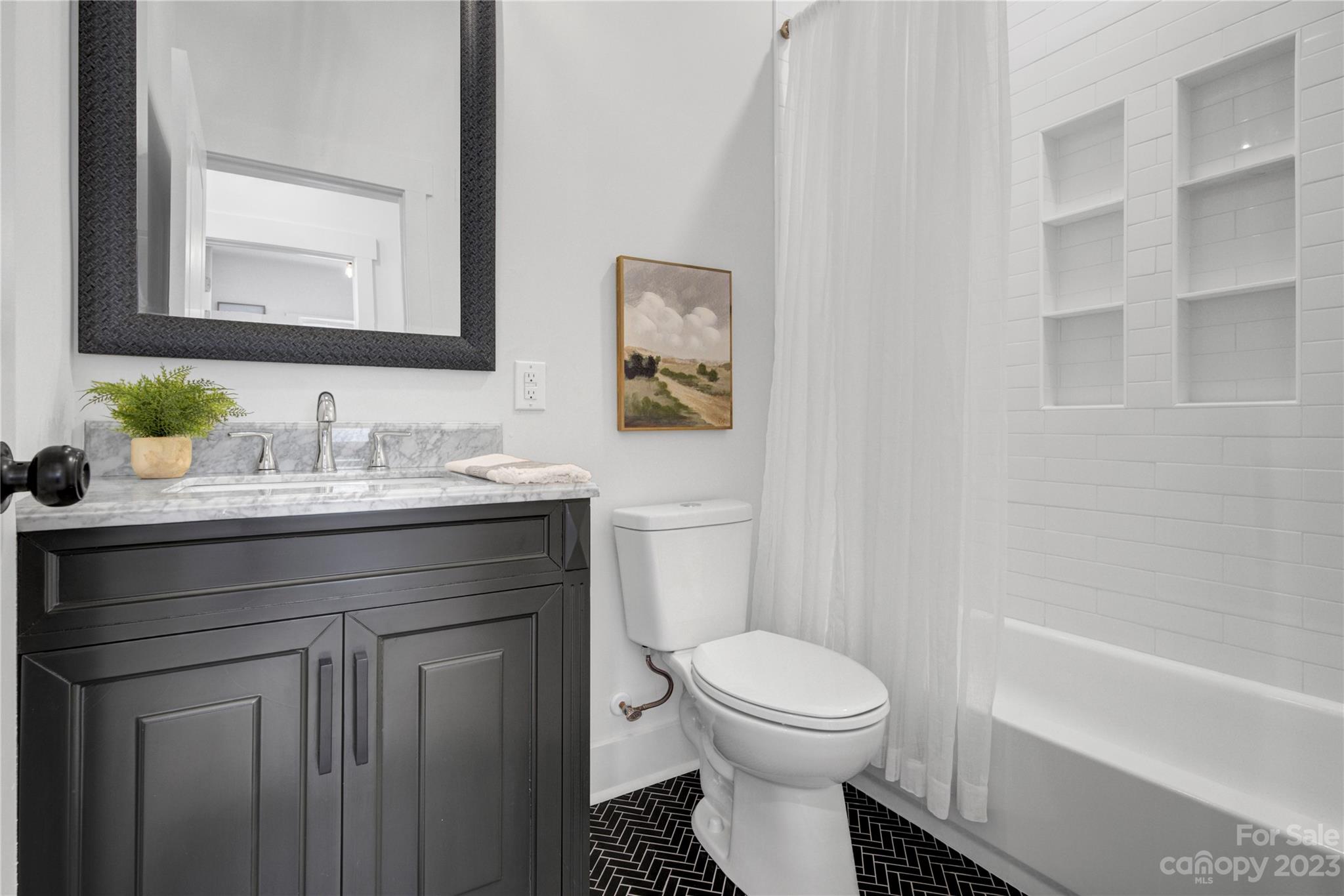 115 Ashe Street York, SC 29745 - Photo 15 of 33 a bathroom with a sink toilet and shower