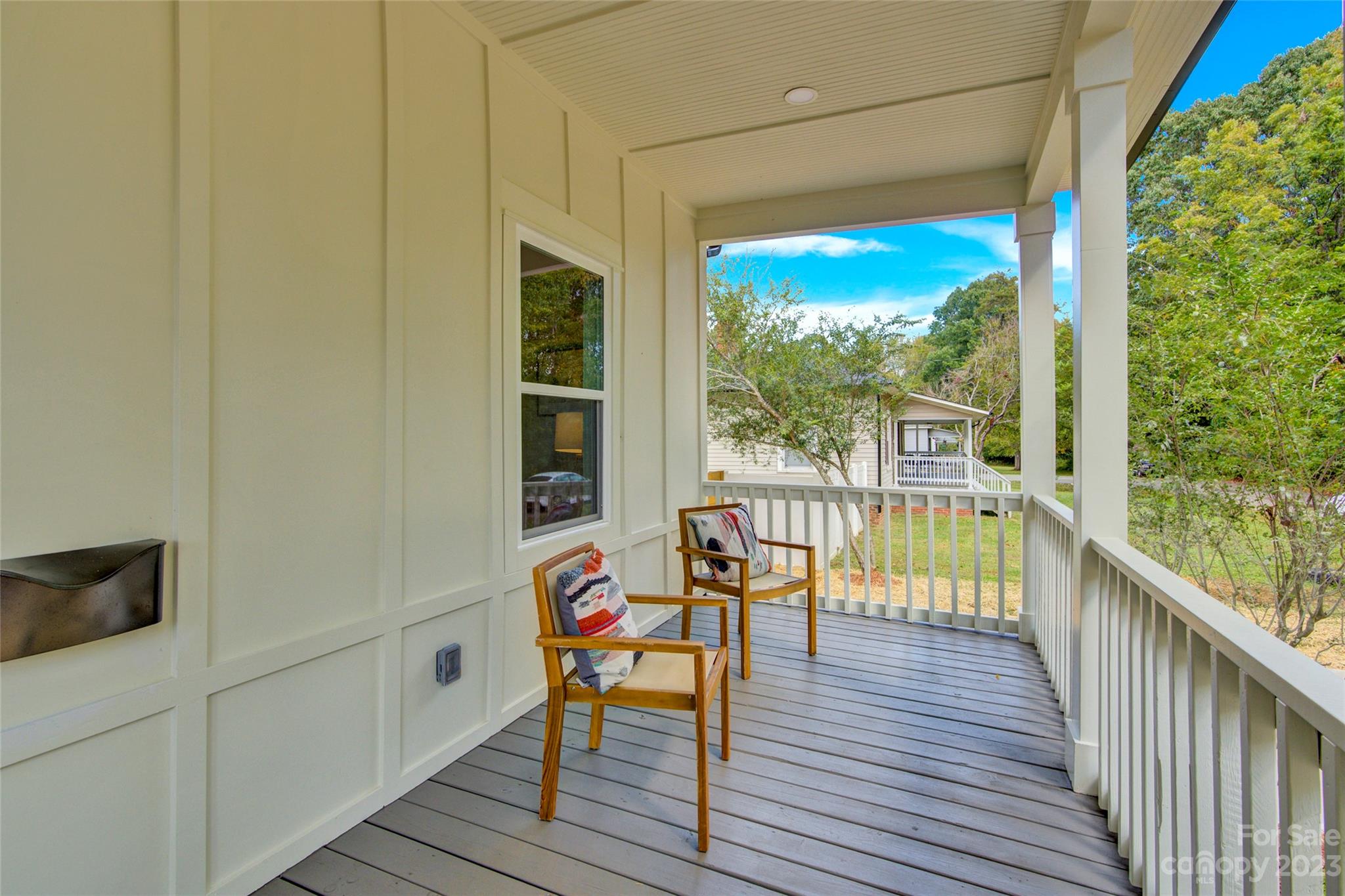 115 Ashe Street York, SC 29745 - Photo 5 of 33 a balcony with wooden floor and outdoor seating