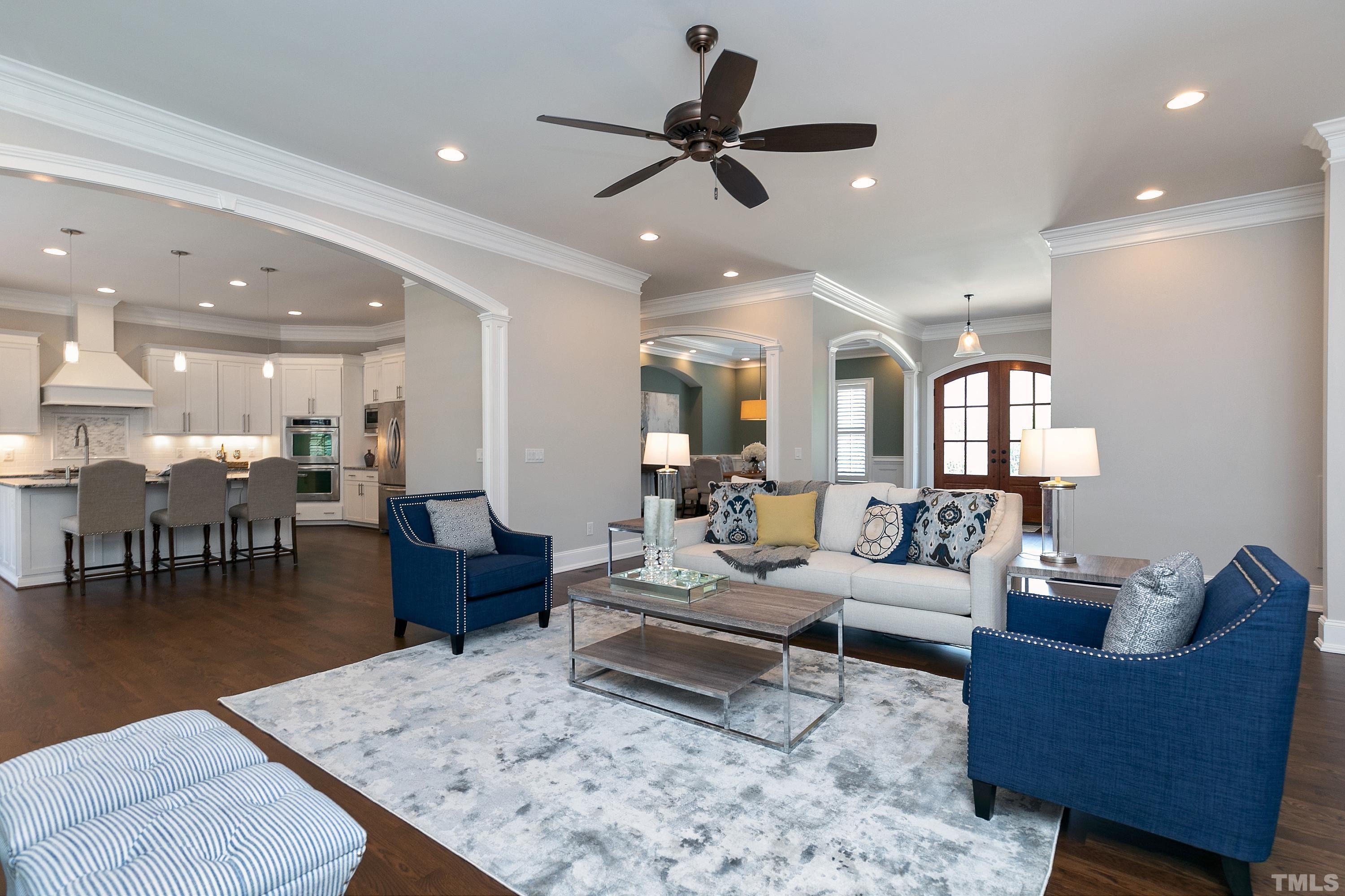 302 Michelangelo Way Cary, NC 27518 - Photo 11 of 44 a living room with furniture and kitchen view
