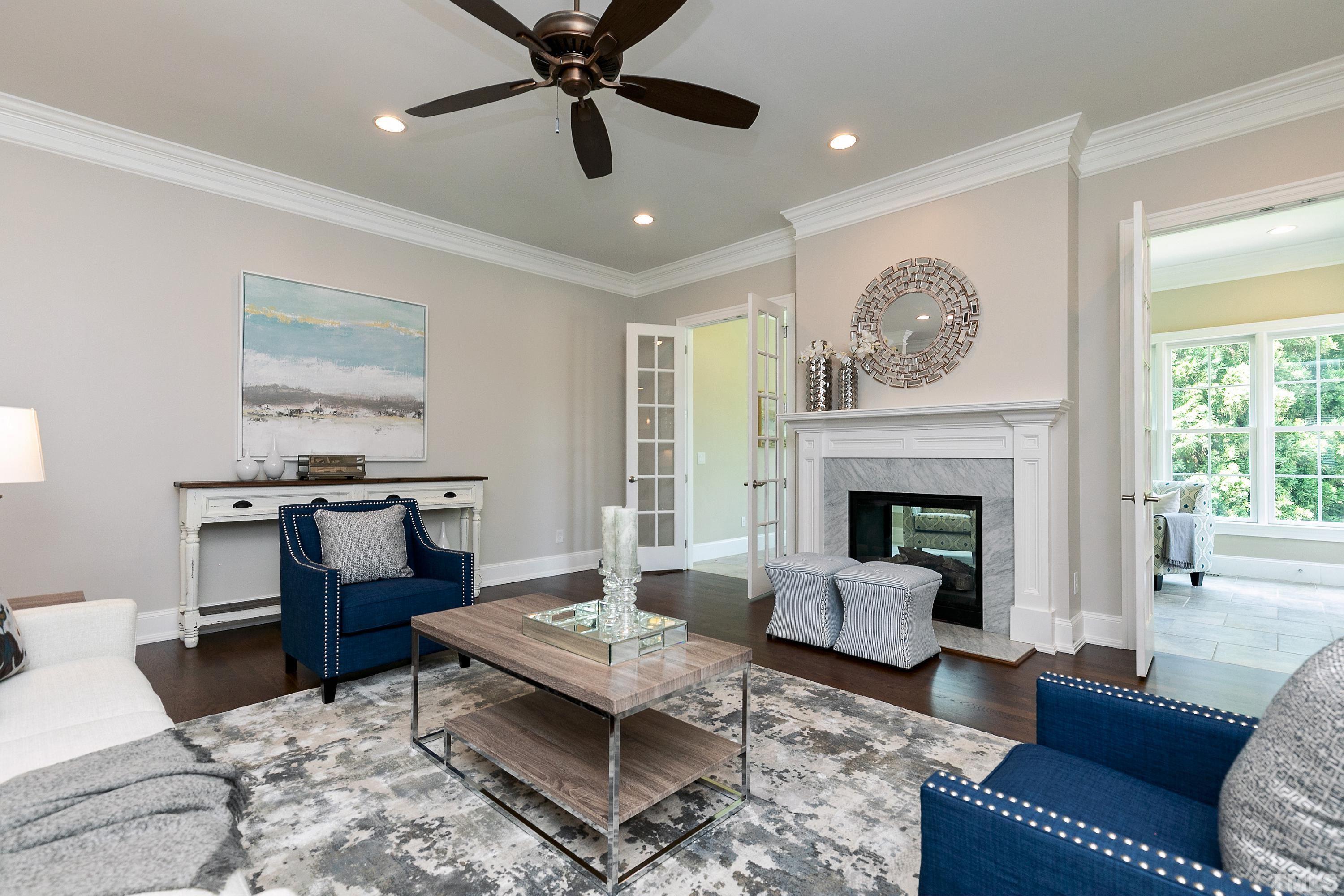 302 Michelangelo Way Cary, NC 27518 - Photo 12 of 44 a living room with furniture and a fireplace