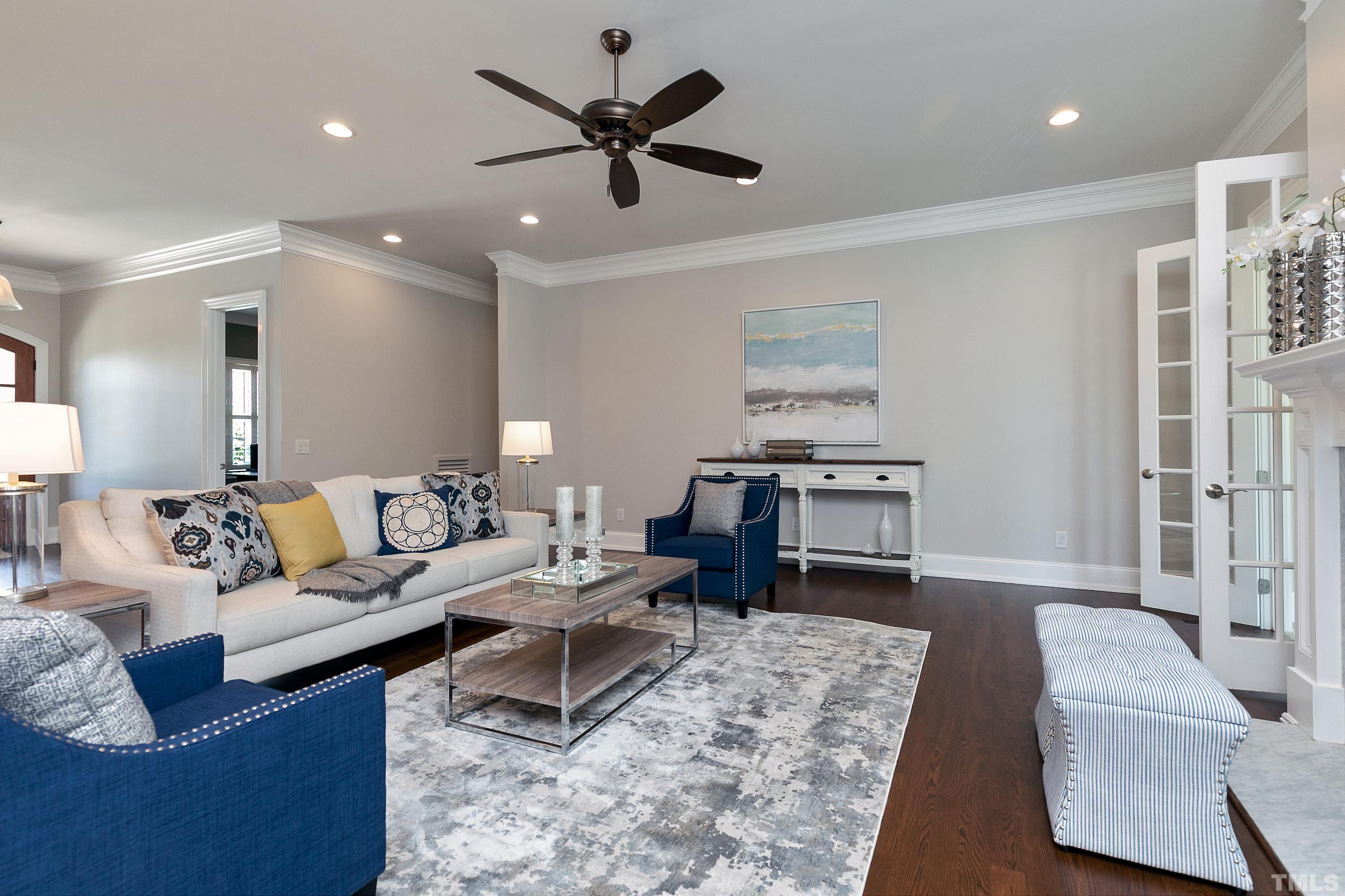 302 Michelangelo Way Cary, NC 27518 - Photo 13 of 44 a living room with furniture and a wooden floor
