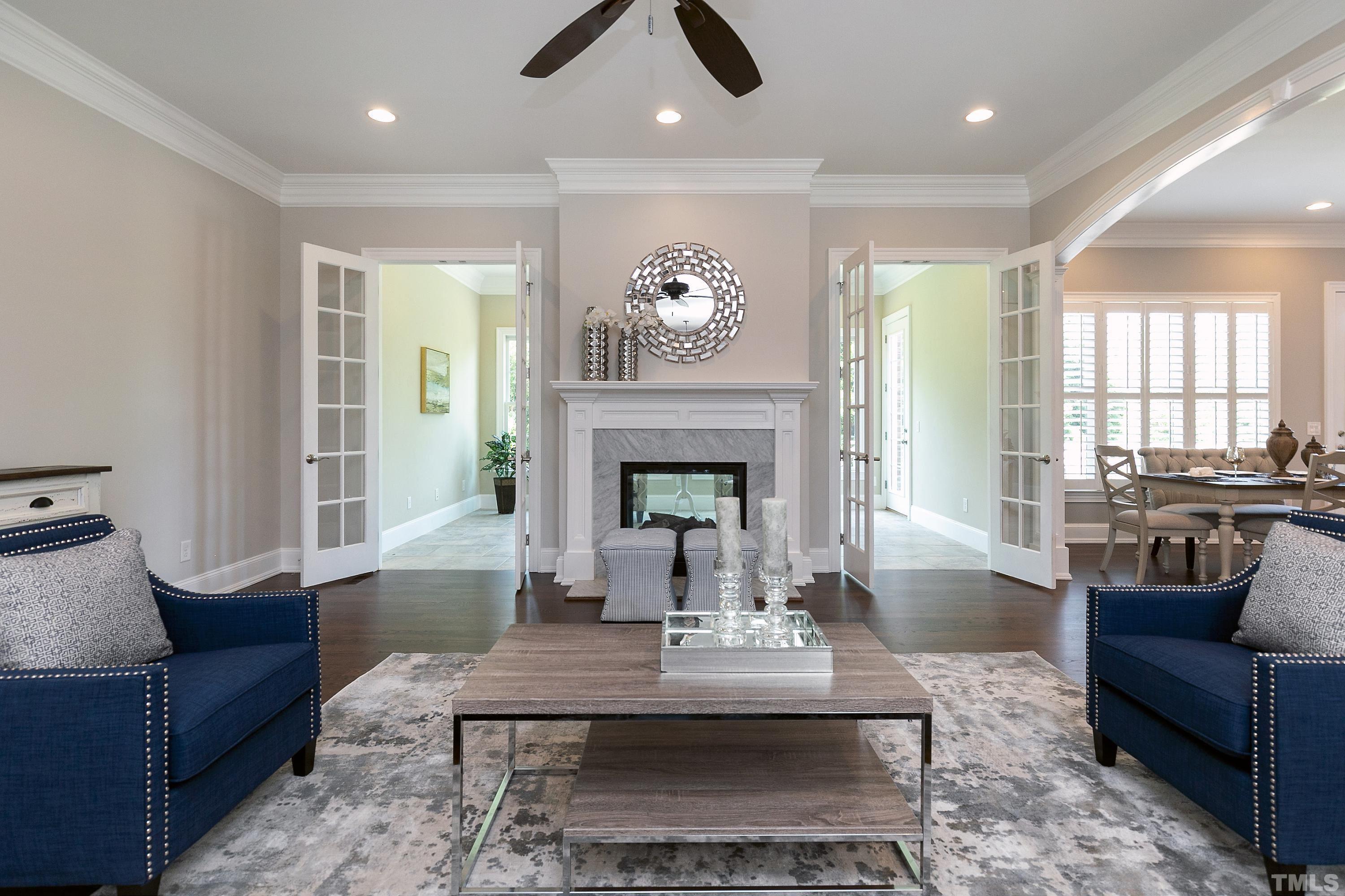 302 Michelangelo Way Cary, NC 27518 - Photo 14 of 44 a living room with furniture and a fireplace