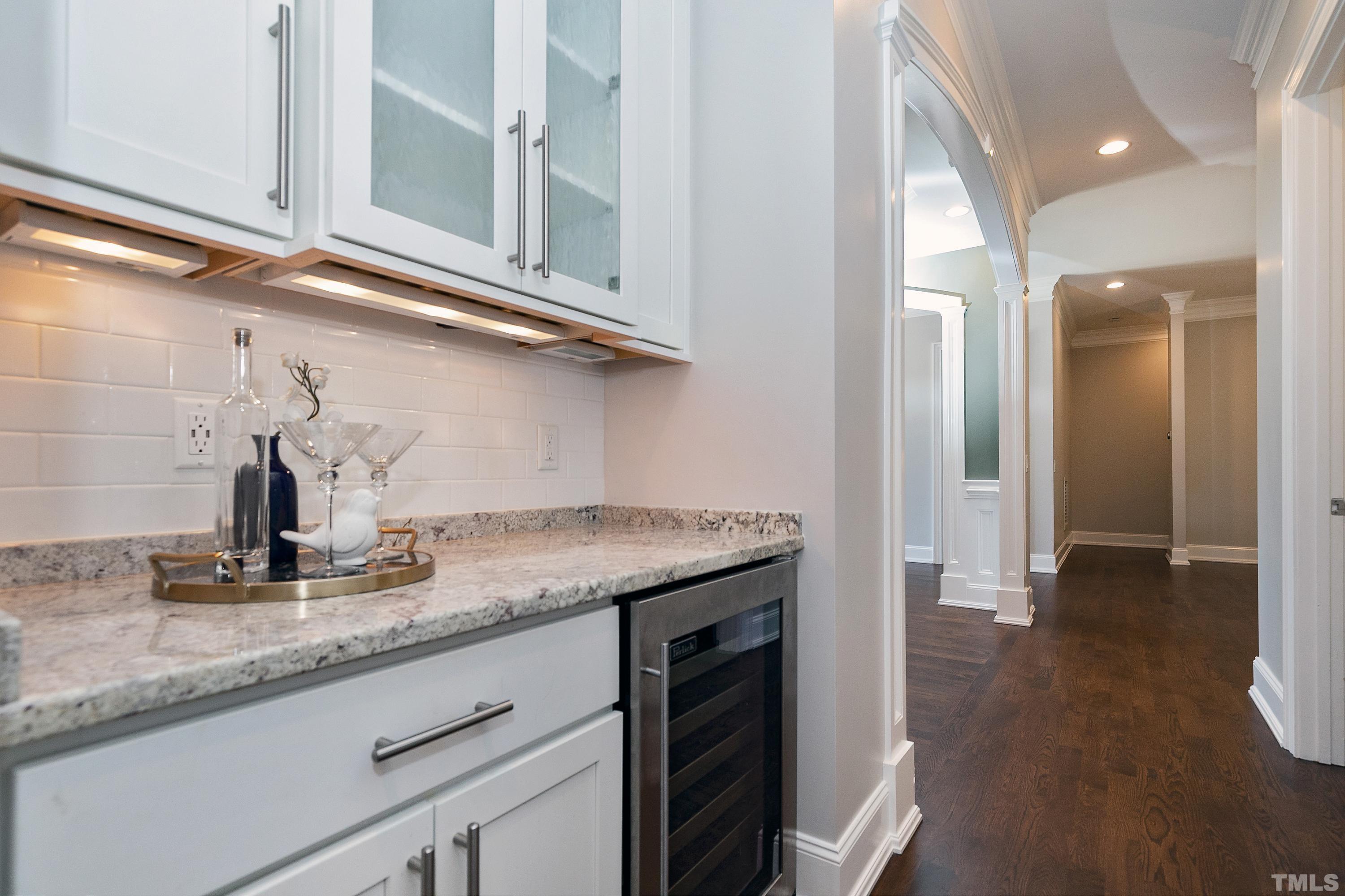 302 Michelangelo Way Cary, NC 27518 - Photo 16 of 44 a kitchen with granite countertop a sink and cabinets