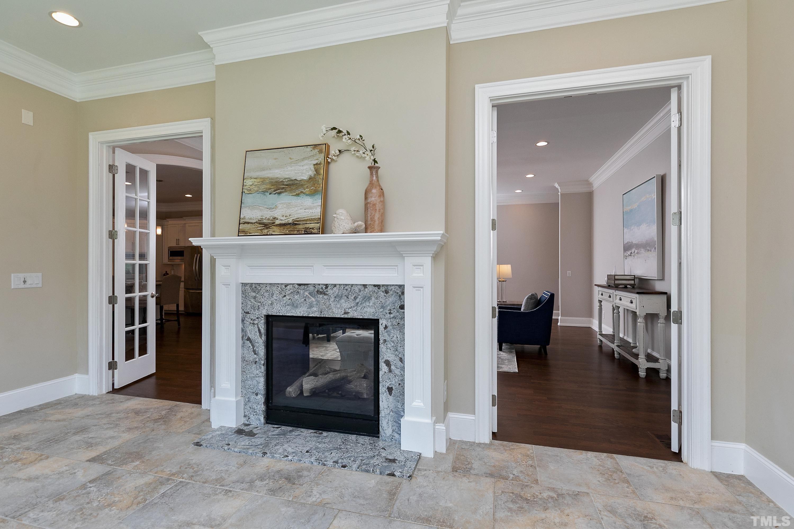 302 Michelangelo Way Cary, NC 27518 - Photo 17 of 44 a living room with furniture and a fireplace