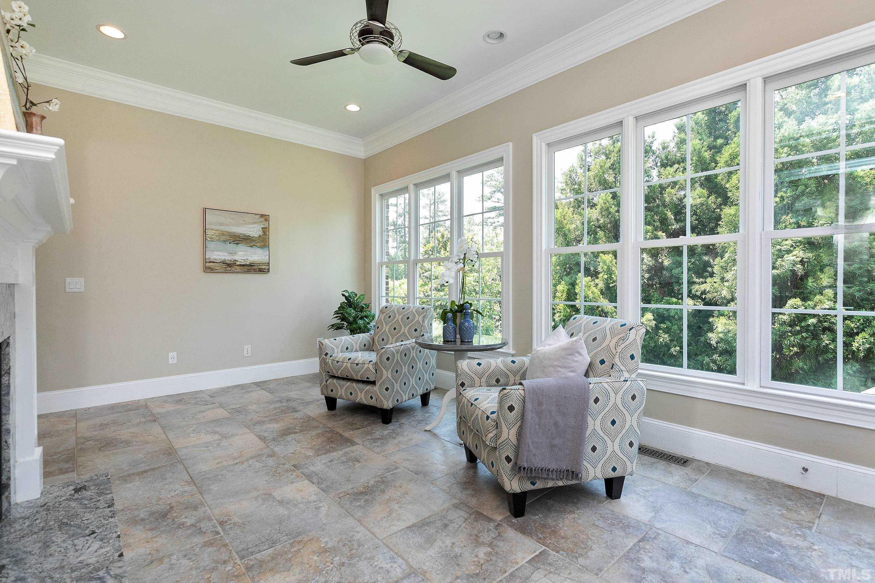 302 Michelangelo Way Cary, NC 27518 - Photo 20 of 44 a living room with furniture and large windows